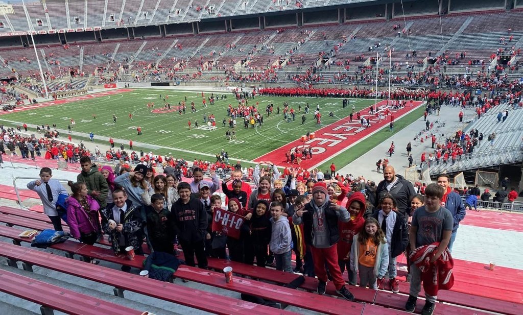 students in a football stadium 
