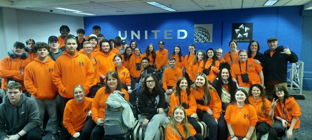 students and chaperones at airport